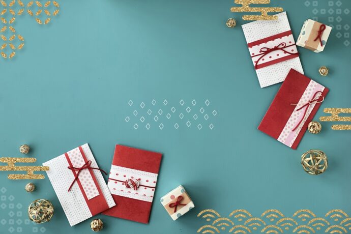 画像：ターコイズブルーの背景に赤白のご祝儀袋